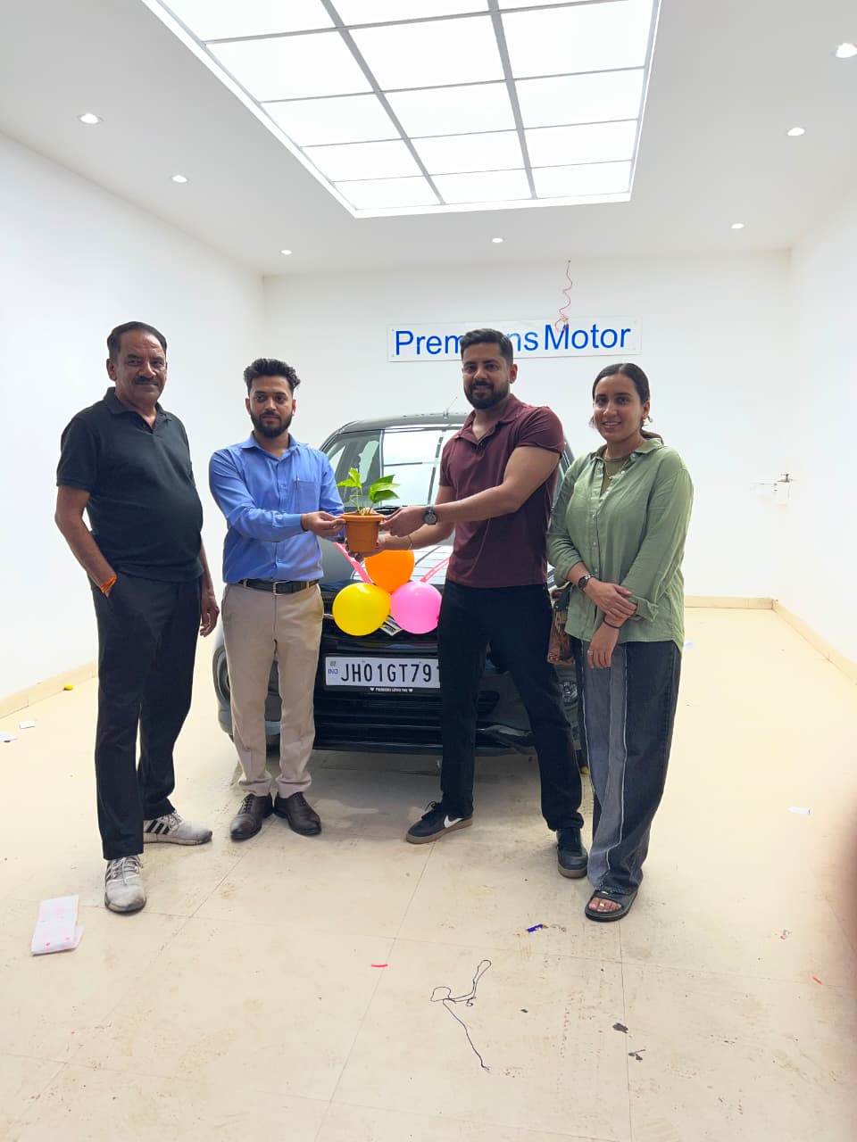 Happy family with new Maruti Suzuki car delivery