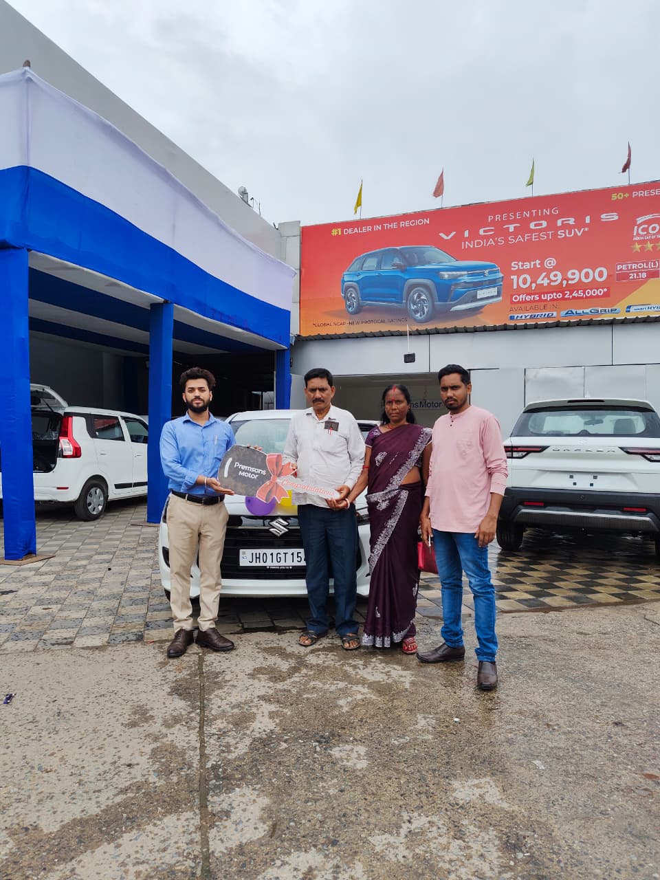 Customer celebrating new car delivery at Premsons Motor